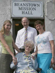 Pictured at the final service at Beanstown Mission Hall is Mrs Violet Wallace whose late husband Andy was a founder member. Included in the photo are her son Paul, daughter Eileen and granddaughter Amy