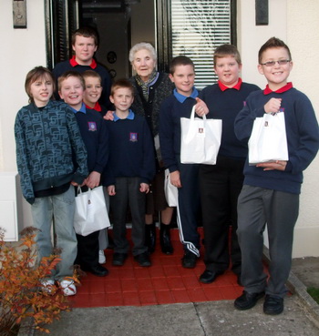 Boys from St Paul's Parish CLB pictured delivering one of their 'credit crunch parcels'.