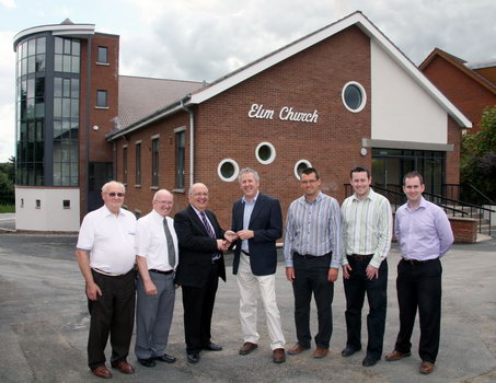 At the hand over of the keys of the new Lisburn City Elim Church Complex on Friday 7th August are L to R: Tom Tate (Finance Officer), David Irvine (Caretaker), Pastor Norman Christie, William Shannon (Architect), Gavin Hewitt (Bailie Associates M & E Engineers), J P McGeough and Conor McCartney (T & A Kernaghan Ltd).