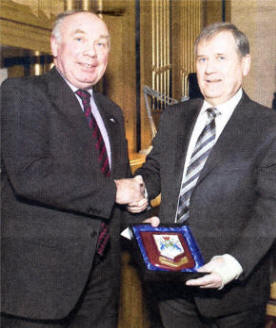 Alderman Mervyn Rea presents an Antrim Borough Council Plaque to Rev. Brian Kennaway in recognition of his long and distinguished ministry in the area.