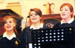 L to R: Suzanne Smyth, Jade Smyth and Nicola Kinghan pictured singing at the service.