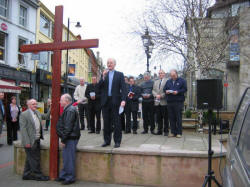 The Rev. Brian Gibson, Minister of Railway Street Presbyterian Church, Lisburn, is pictured welcoming those assembled at Market Square, Lisburn, for a short act of Worship following the Good Friday ï¿½Carrying of the Crossï¿½ march of witness.