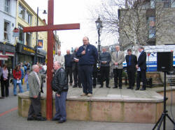 The Rev. Brian Anderson - Minister of Seymour Street Methodist Church, is pictured leading prayers during a short act of Worship in Market Square on Good Friday 25th March 2005.
