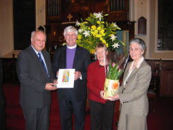 Mr. Perry Reid - Clerk of Session (left) and Mrs. Elizabeth Watt present gifts to the Rt. Rev. Dr. Ken Newell - Moderator of the General Assembly and his wife Mrs. Val Newell at a service in First Lisburn Presbyterian Church on Sunday 3rd April 2005.