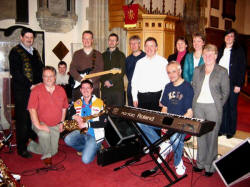 Some of the musicians and vocalists that lead the lively praise during React 2005 at Lisburn Cathedral Saturday 15th to Sunday 23rd October.  Pictured after morning service in Lisburn Cathedral on Sunday 23rd October are L to R:  Michael Heaney, Michael Wright - Percussion, Jonathan Irvine - Guitar, Philip McConnell, Tim Webb, Des Henry, David Brattle - Keyboards, Francis Jess, Rosemary Irvine, Jean Craig and Jo-Anne Irwin.  (kneeling at front)  Frank Bailie - Music Co-ordinator and Jason Parker - Saxophone.
