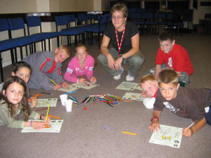 Heather Wright pictured at the Salvation Army Holiday Bible Club - 'Be Incredible' with children (clockwise from left) Georgia Coleland, Richard Copeland, Dale Gilmore, Megan Vevers, Cameron Williams, Tyler Morrison and Jordan Morrison. US34-743SP 