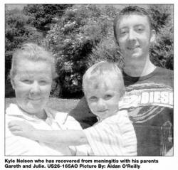 Kyle Nelson who has recovered from meningitis with his parents Gareth and Julie. US26-165AO Picture By: Aidan O'Reilly