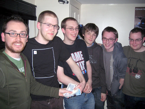 Former Wallace High School student Paul Kelly (third from right) and a winning team of Queen�s students pictured receiving their prize money at a recent computer games evening at PONG computer gaming centre, Belfast. L to R: John Busch (lecturer) and the team - Mike Hackworth, Gary Fleming, Paul Kelly, Dean Hannigan and Andrew Carr.