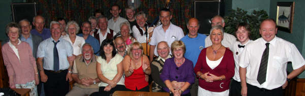 Pictured on the last evening before the summer break are Noel McMaster and Drew Rowan from Bakerloo Junction and some of the folk who enjoy the band play each Friday night at the Ivanhoe Hotel, Carryduff. During the evening the band linked up by telephone with regulars Barry and Shirley Jones, who are on holiday in Melbourne, Australia as the performed the well-known Irish song �If we only had old Ireland over here�.