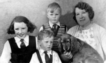 Kelly family photograph taken at Tullymacarette Primary School in about 1952.  Mary Emily Kelly (nee Harvey) with Vera (now Vera Watson), George and John.