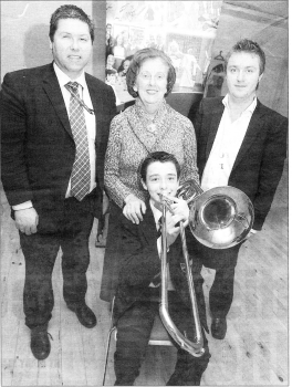 Andrew McCoy receives a grant of �1200 . from Lisburn Arts Advisory Committee to pay for music tuition in London. Presenting the grant are Stephen McLaughlin Chairman of LAAC, Winifred Bell board member LAAC and Richard Yarr, Vice Chairman of LAAC. US0507-127A0