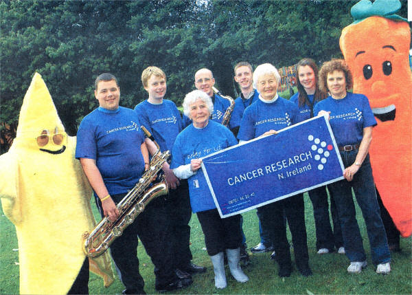 At the Cancer Research Fun Walk in Moira were Netta Dillon, Sheila Herron, Caitriona Hughes - Moira Cancer Research Committee. Also providing support were South Ulster Saxophone Ensemble. US2607-359DW