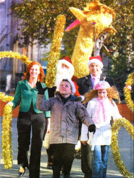 Helping Santa gather up the five gold rings and golden calling birds in preparation for the !enter parade are the Mayor of Lisburn, Councillor James Tinsley; Sarah Callendar of event sponsor, Dunmorris, with Ryan White and Megan Murray from Knockmore Primary who will take part in the festivities.