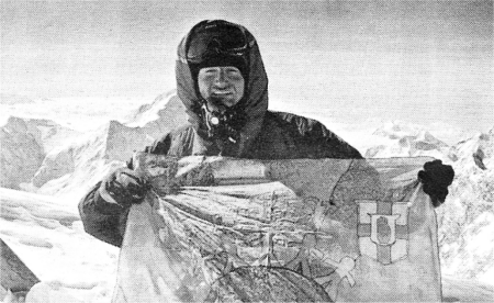 Roger at the top of Everest with a Friends School flag