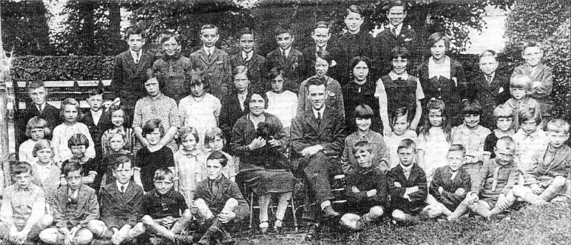 The 1931 Ballinderry Primary School photograph with Mr and Mrs Blacker - complete with Jumbo, the mysterious missing dog. Front row: 