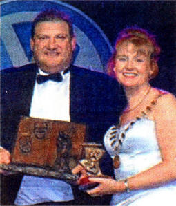 Musical Director Ian Milford presented with the award for Best Modern Opera by Fiona Sheerin