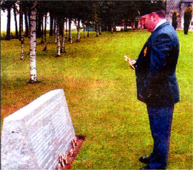 Clifford Macartney laying a cross at the Ulster Tower memorial. Mr Macartney's relative Rifleman Robert Quigg, who was awarded the VC, is commemorated on the memorial.