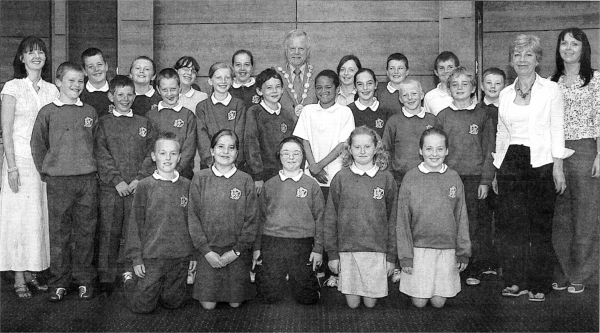 Students from St. Colman's Primary School, Lambeg in the Council Chamber with the Mayor, Councillor Trevor Lunn, their teacher; Ms Gallen and Classroom Assistants.