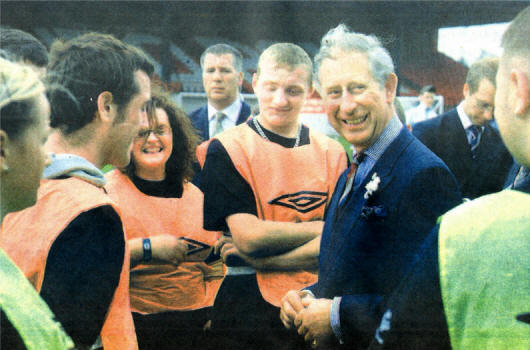 Prince Charles with young people from Lisburn at The Oval Football Ground in East Belfast.