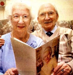 Florence and Samuel Press read their card from the Queen on their 65th Wedding Anniversary. US4007-539C0