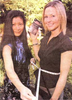 Model Hannah Su measures the waistline of Robert Roberts' Sinead Adair as the company launches its own brand of Pu-erh tea in Northern Ireland.