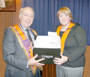 Bro Eric Jess, Worshipful District Master is pictured presenting a gift of Tyrone Crystal to Alicia Dickson of the Lower Iveagh Cultural and Heritage Committee in recognition of her work in organising events held during this year�s Ulster Scots Festival. The presentation was made at the Lower Iveagh District LOL No 1 district meeting in Dromore Orange Hall on Thursday 9th October.