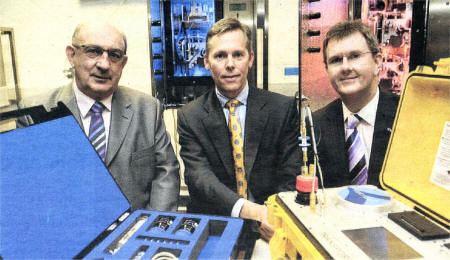 John Cunningham (left) former MD of Kelman LTD pictured with Bob Gilligan, Vice President of General Electric and Junior Minister Jeffrey Donaldson at the acquisition announcement by GE Energy of the Lisburn based company. Photo John Harrison.