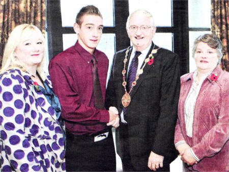 June Stout and son Phillip, who has just returned from a tour of duty with the army in Afghanistan, being welcomed back to Lisburn by Mayor Ronnie Crawford and Mayoress Jean Crawford. US4408-514cd