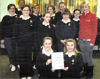 Girls' Brigade members who raised �65 for Action Cancer with their Captain Karen Allen and Sarah Quinlan from Action Cancer.