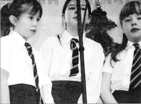 Katie Bailey, Rachel Martin and Gemma Pollock singing together at the 75th Anniversary celebrations