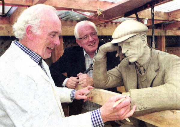 Whiteabbey based artist John Sherlock makes the final changes to the Harry Ferguson sculpture before it goes to Dublin for bronzing. Overseeing the work is Chairman of Lisburn City Council's Economic Development Committee, Councillor Allan Ewart.