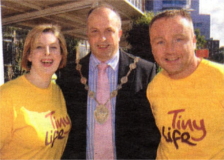 Barry and Mags White with Lisburn Mayor James Tinsley before the start of the sponsored walk from the RVH to Craigavon