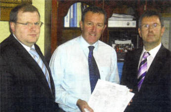 Lagan Valley MP Jeffrey Donaldson and MLA Jonathan Craig hand over a petition to Roads Minister Conor Murphy, objecting to the recent on-street parking charges in Lisburn.