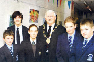 Lord Mayor Ronnie Crawford with a group of first prize winners who took part in a schools' photography competition. The winning pictures are on display in the Island Arts Centre. US4608-550CD
