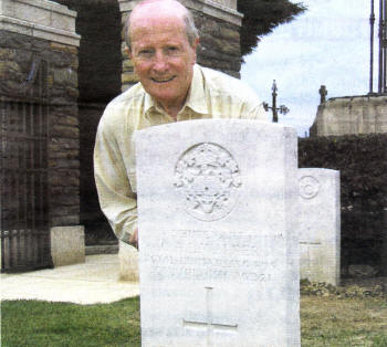Rev Canon Alex Cheevers at the grave of Claude Walker.
