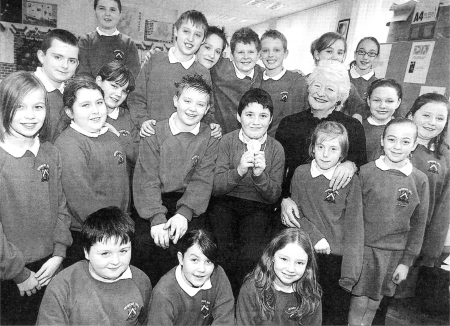 Dame Mary Peters pictured with children at Seymour Hill Primary during her visit to the school. USO407-118A0