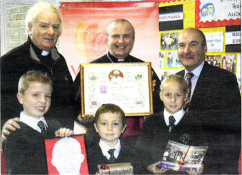 Back row: Father Derrnot McCaughan, Bishop Donal McKeown and Mr Patsy McClean. Front Row: Owen Beckett, Michael Romano and Melissa Robinson.