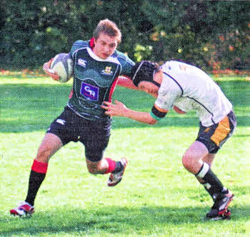 Friends' squad member Michael Cochrane in action against Capilano RFC in the tour shirts sponsored by GR Homes.