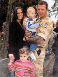 Sgt Darren King is met by wile Cpl Maria King and children Ryan (18 mths) & Tegan.