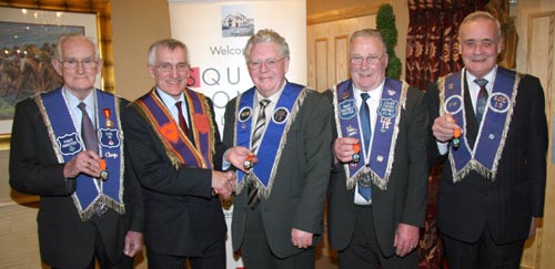 Bro Wesley Jess (Worshipful Master) receives his 50-year jewel from Bro Norman Mulholland of Drumreagh LOL 1661. Included are Bro Hubert Steele (Past Master), Bro William Campbell (Secretary) and Bro Isaac McKnight (Past Master) who also received this long service award.
