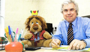 Pond Park Primary School principal Mr Victor Spindler hard at work in his office, with the school mascot on his desk. US1709-529CD