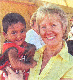 Bernie with three-year-old Surajit, the little boy she has sponsored. Bernie will sponsor Surajit's education and she intends to go back to Calcutt and visit him in the future. Surajit lives in one of the Hope homes.