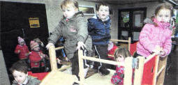 Children playing on the climbing frame at Barbour Nursery School. USO409-103A0