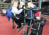 Children at Barbour Nursery enjoy playing on the climbing frame. USO409- IMO