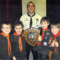 2nd Lisburn (Wallace School), the winners of the Lisburn & District Cub Expandite Shield competition, with A.D.0 Cubs David Hilland.