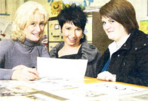Susan Boreham, PE teacher at Fort Hill College, with former pupils Tina Warren and Karen Brand (nee Armstrong), looking through some old sporting pictures during an evening to mark the college's 50th anniversary. US0509-503cd  