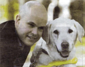 Mark with his faithful guide dog Larry who retired recently.