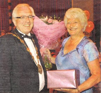 Lisburn Mayor Allan Ewart presenting Dame Mary Peters with a gift at Mary Peters 70th Birthday celebrations in Lagan Valley Island, Lisburn. Photo John Harrison.
