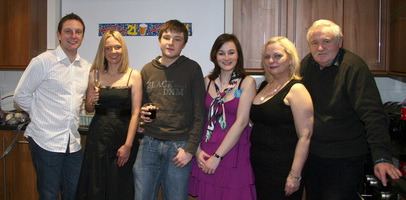 Paul and Laura Kelly pictured at their 21st birthday party with their brother Chris, sister Emma and parents John and Sylvia (right).