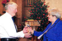 Joan Bradshaw presenting a cup to George Toombs (Company President) in memory of her father Matthew Kearney and uncle Jack Kearney, who were former captains. 